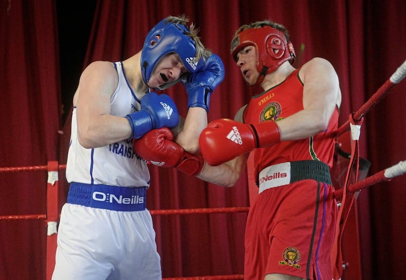 John Donaghey (left) of Star of the Sea ABC covers up as East Down&rsquo;s Oisin Lowry counters during their 80KG B5 Ulster final at the weekend. Donaghey went on to win. Picture by Mark Marlow 