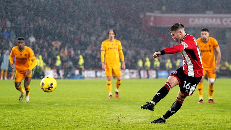 Sheffield United’s Oliver Norwood scores a stoppage-time penalty against Wolves (Nick Potts/PA)