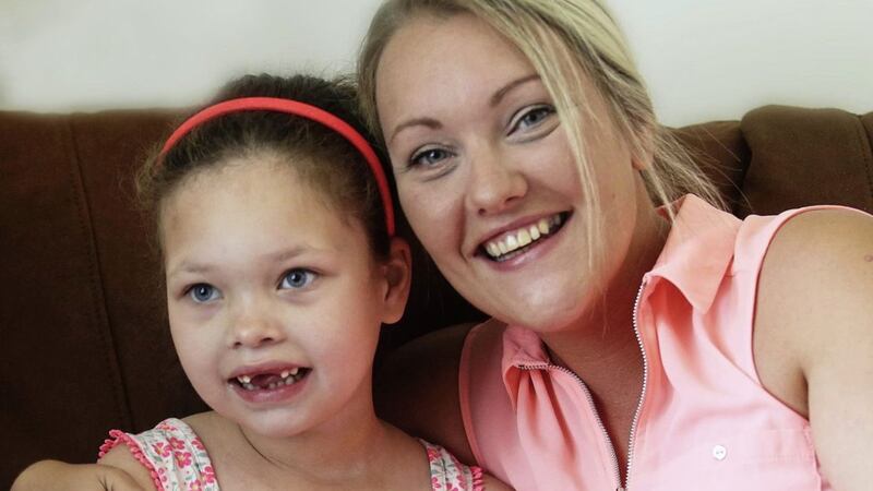 Sophia Gibson at home in Newtownards with mum Danielle. The Belfast trust applied to an expert doctor-led panel to access medicinal cannabis for the little girl. Picture by Hugh Russell.