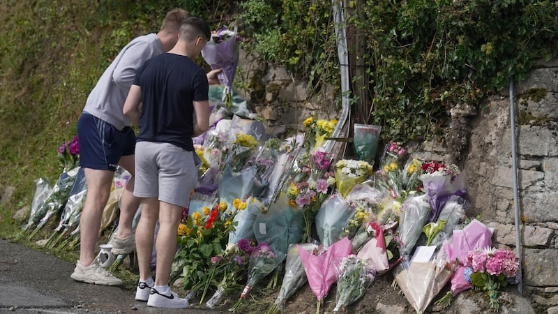 Flowers and tributes left at the scene in Clonmel, Co Tipperary, where four young people died in a car crash (Brian Lawless/PA)