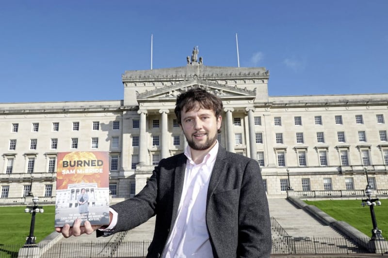 Writer Sam McBride with his book Burned about the RHI scandal which led to the collapse of Stormont. File picture by Laura Davison, Pacemaker Press 