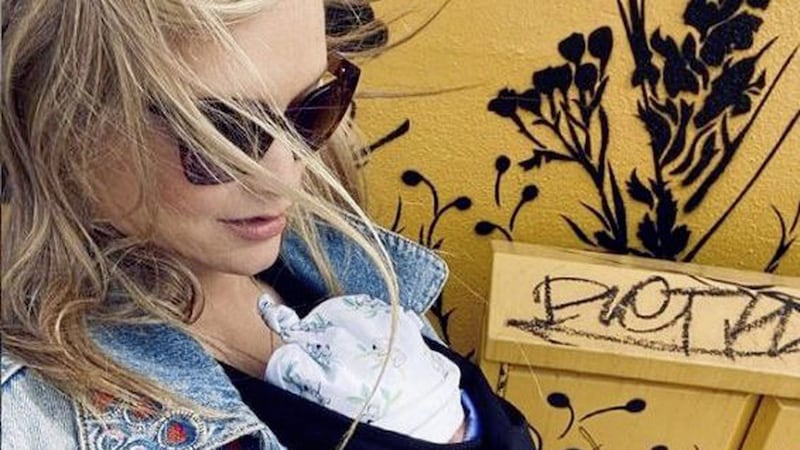 Laura Whitmore posted a snap of the baby girl in a sling on her Instagram account 