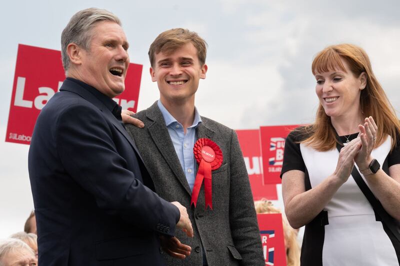 Newly-elected Labour MP Keir Mather (centre) is congratulated by Labour leader Sir Keir Starmer and deputy leader Angela Rayner at Selby football club in North Yorkshire
