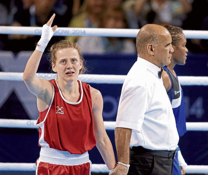 Michaela Walsh turns away in disbelief after her controversial defeat to Nicola Adams in the 2014 Commonwealth Games final 