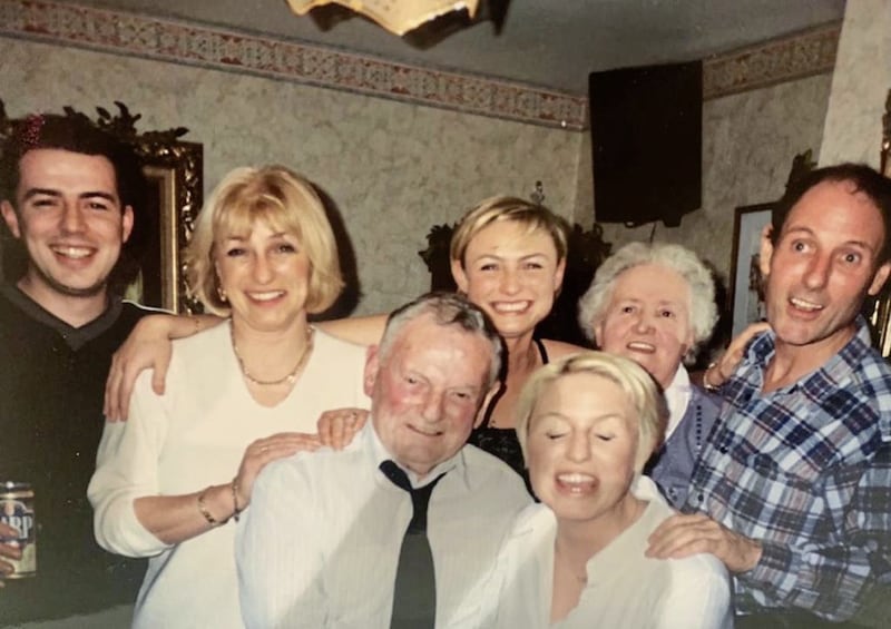 Marie Boyle, centre back, with, from left, her brother Shane, mum Briege, grandfather Tommy, sister Sasha, grandmother Margaret and dad Brian, gathered to celebrate Marie&rsquo;s 21st the evening before the fire