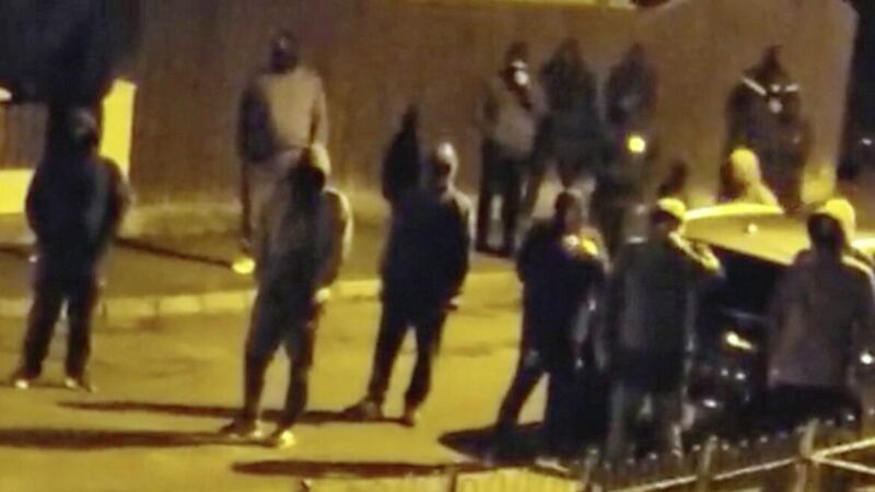A gang of masked men videoed intimidating a family in Carrickfergus last Thursday 