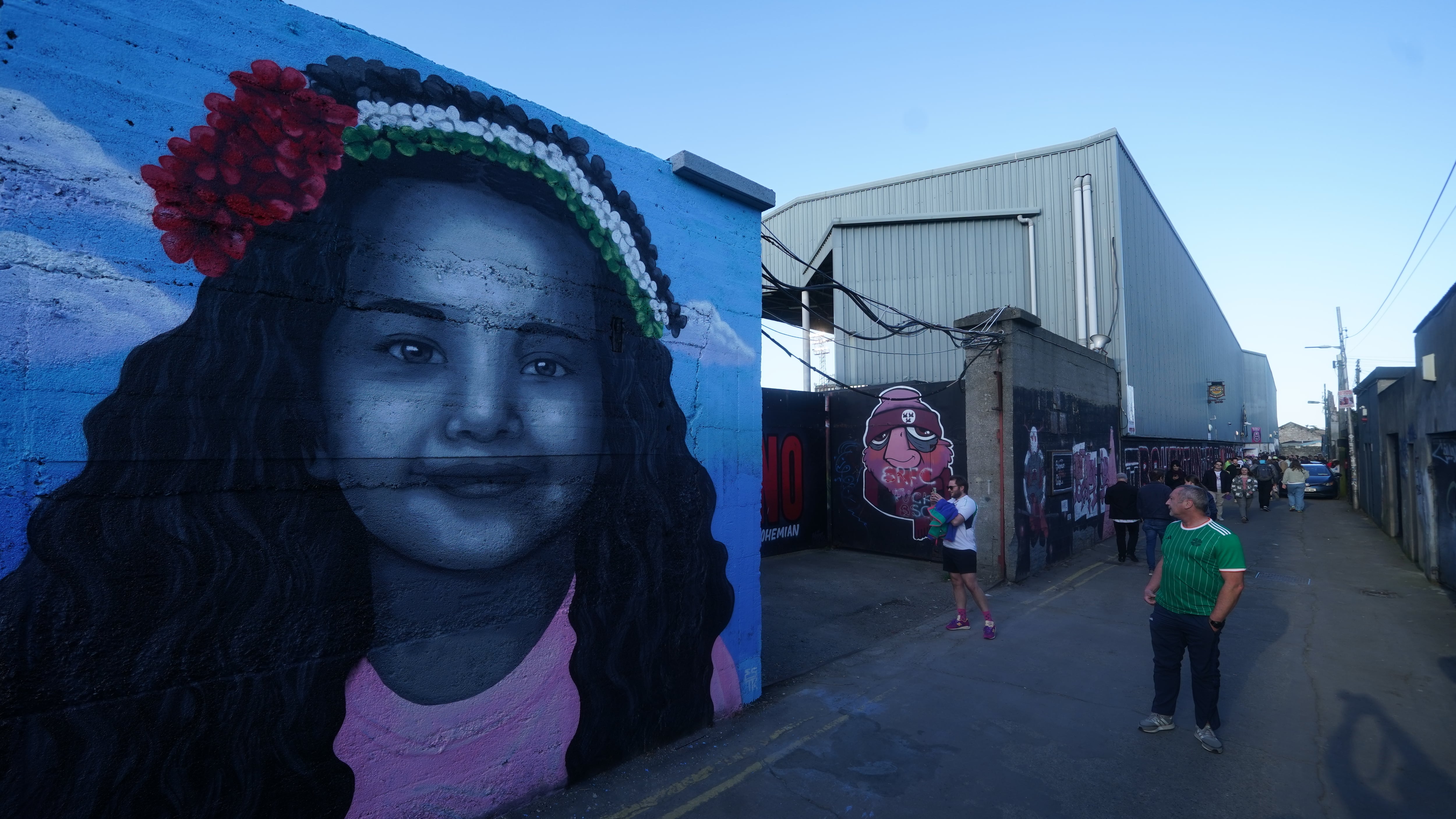 A mural of Hind Rajab, a 6-year-old Palestinian girl who was killed in Gaza, along with several family members and paramedics, by artist Emmalene Blake outside Dalymount Park in Dublin