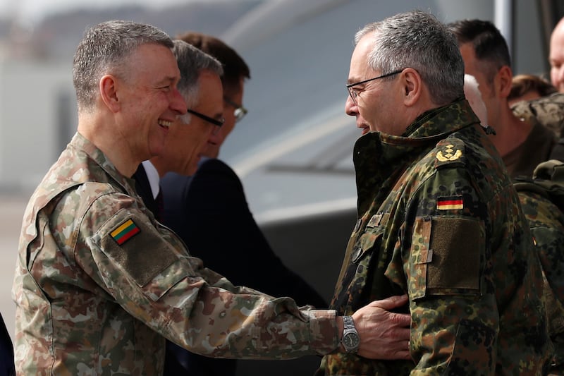 Lithuanian chief of defence Gen Valdemaras Rupsys, left, welcomes German Army Chief Lt Gen Alfons Mais (Mindaugas Kulbis/AP)