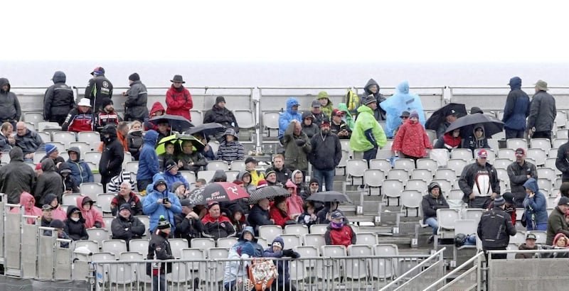Spectators shelter under umbrellas at last month&#39;s International North West 200 races. Picture by Margaret McLaughlin 