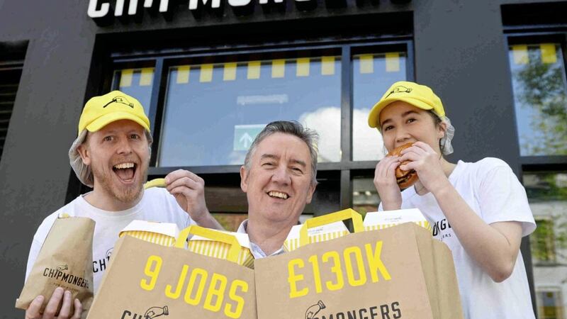 Martin McKeown (centre) pictured with staff members at the new Chipmongers restaurant on University Street in Belfast. 