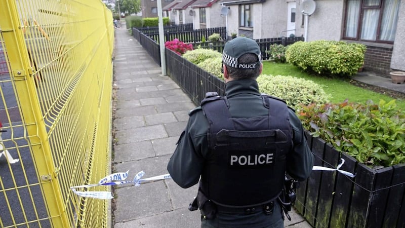 Police remained at the scene yesterday where Laurence Shaw was found dead in the Seacourt estate in Larne. Picture by Mal McCann 