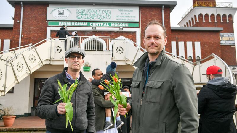 James Lynch and Marcus Kapers handed out flowers at Birmingham Central Mosque to show their support to the Muslim community.