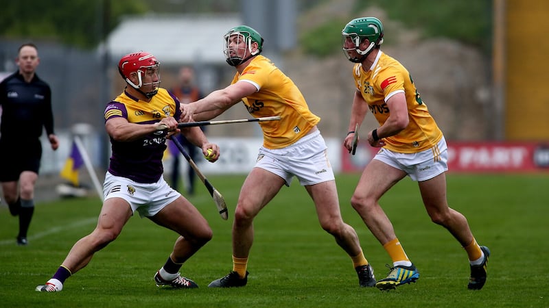 Wexford's Lee  Chin tries to escape the attentions of Antrim pair Gerard Walsh and Paul Boyle during their Leinster SHC clash at Chadwicks Wexford Park. Picture by Seamus Loughran