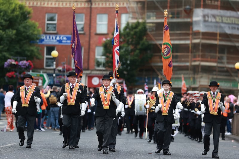 Orangemen in traditional dress parading through Belfast. Picture by Liam McBurney/PA Wire