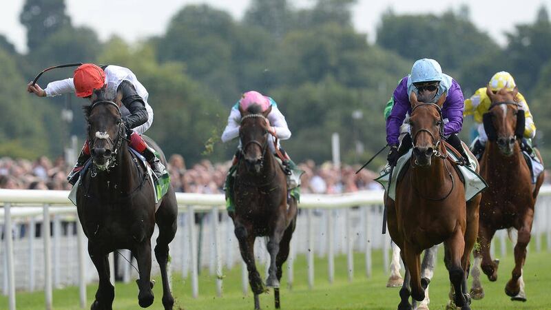 A DAY AT THE RACES: Arabian Queen ridden by Silvestre de Sousa (right) beats hot favourite Golden Horn ridden by Frankie Dettori (left) to win the Juddmonte International Stakes during day one of the Ebor Festival at York yesterday. The 50/1 shot caused arguably the biggest upset of the season in flooring the Derby and Eclipse winner 	 