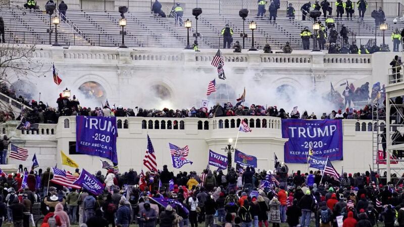 Violent protesters, loyal to President Donald Trump, stormed the Capitol in Washington DC in January in an attempt to overturn America's presidential election and keep Joe Biden from replacing Trump in the White House. Picture by AP Photo/John Minchillo