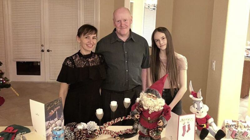 Olga Hurley (L) with her husband and daughter Adelina 