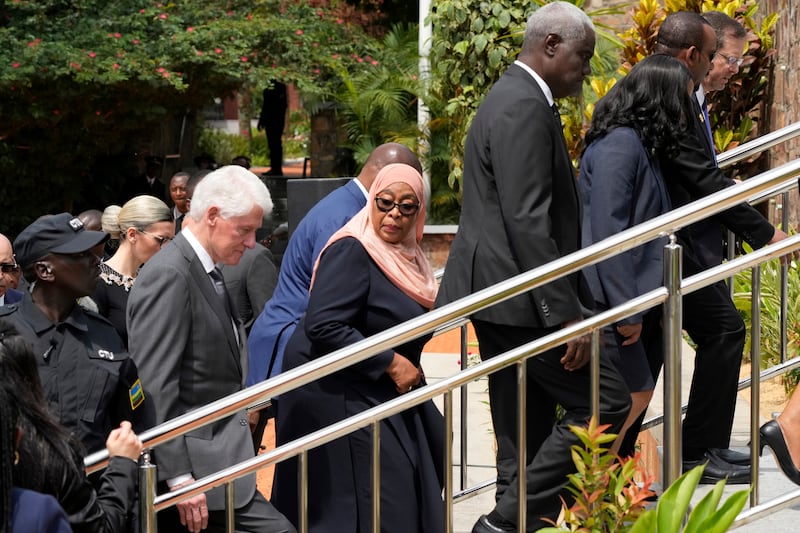 Tanzania’s President Samia Suluhu Hassan, centre, and other dignitaries laid wreaths at the Kigali Genocide Memorial in the Rwandan capital (Brian Inganga/AP)