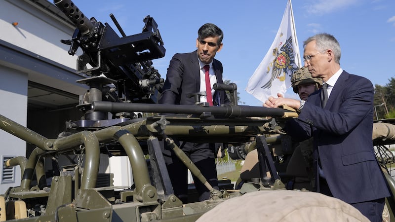 NATO Secretary General Jens Stoltenberg (right) and Prime Minister Rishi Sunak inspect weaponry at the Warsaw Armoured Brigade in Warsaw, Poland. Picture date: Tuesday April 23, 2024.