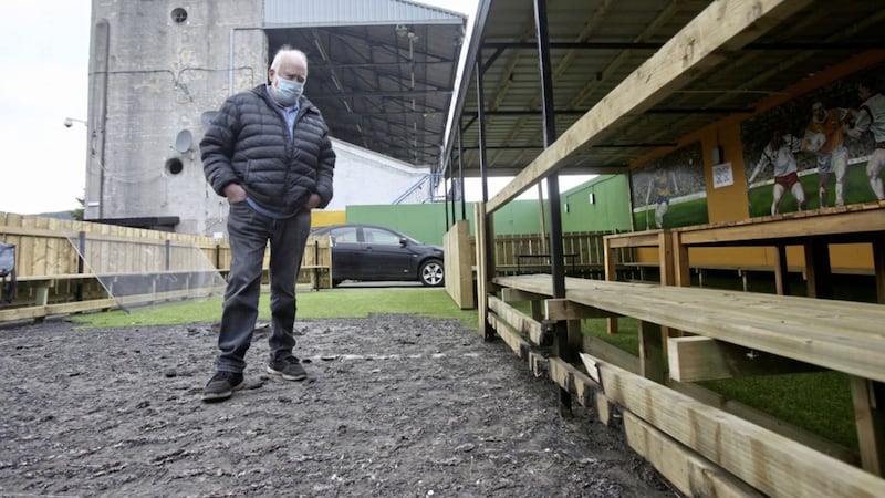 Bob Murray, chairman of Casement Social Club in west Belfast, looks at the damage caused by the fire. Picture by Mal McCann 