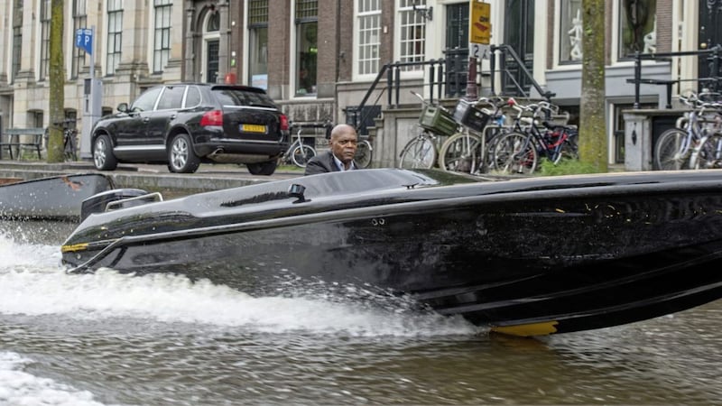 Samuel L Jackson goes for a speedboat ride in Amsterdam, as you do, in The Hitman&#39;s Bodyguard 