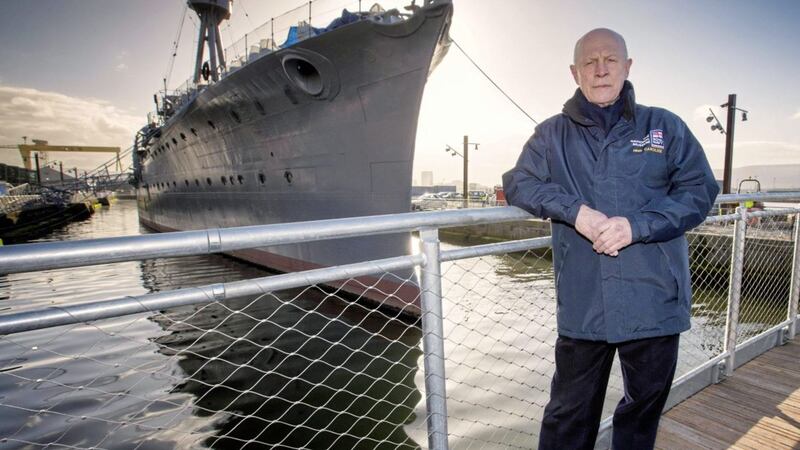 Captain John Rees from the National Museum of the Royal Navy at the newly installed footbridge connecting Alexandra Dock with the new Pump House visitor centre and HMS Caroline 