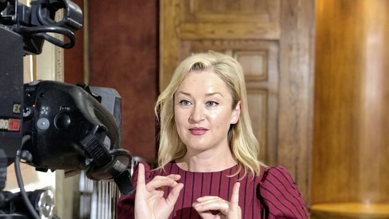 Irish Sign Language interpreter Amanda Coogan, who is also an award-winning performance artist, at work in front of the TV cameras 