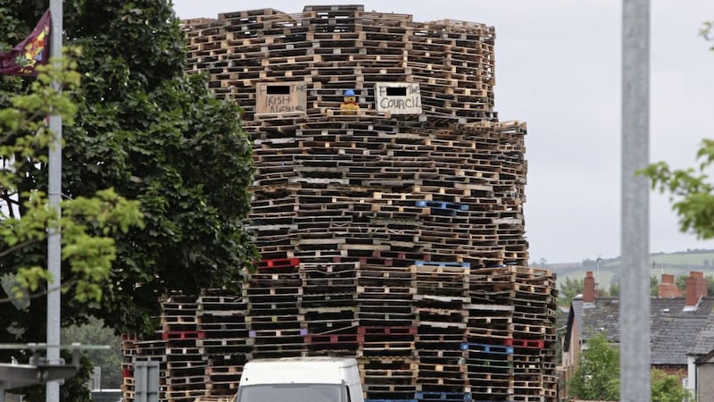 A sign on top of the bonfire at Ravenscroft Avenue in east Belfast states &quot;F**k The Irish News&quot; 