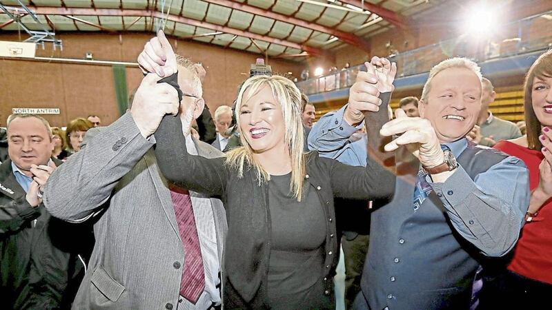 Michelle O&#39;Neill celebrates her victory with Ian Milne and Mid Ulster MP Francie Molloy 