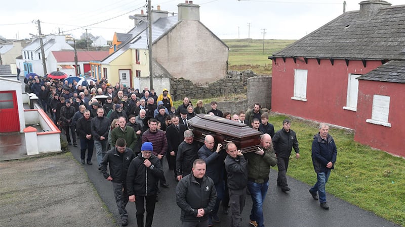 &nbsp;The coffin of Patsy Dan Rodgers makes its way to St Colmcille's Church on Tory Island. Picture by Niall Carson, PA