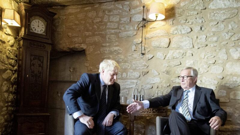 Boris Johnson with European Commission President Jean-Claude Juncker, inside Le Bouquet Garni restaurant in Luxembourg, prior to a working lunch on Brexit. Pictures by Stefan Rousseau/PA 