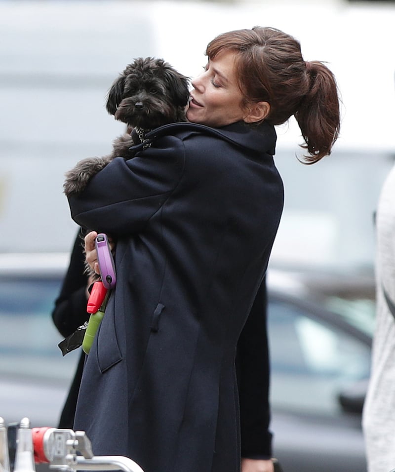 Anna Friel cuddles dog Maggie May on Marcella set