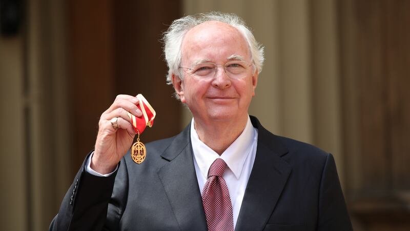 Best-selling writer Sir Philip Pullman was knighted by the Prince of Wales during a Buckingham Palace investiture ceremony.