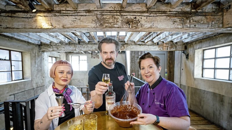 Belfast Whiskey Week organiser Paul Kane, centre, launches the 2023 programme with mixologist Emily Doherty, left, and Geri Martin, right, from The Chocolate Manor.