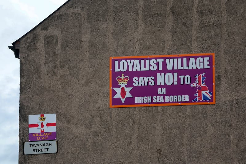 A loyalist poster against a border in the Irish Sea on a wall in the Village area of south Belfast PICTURE MAL MCCANN