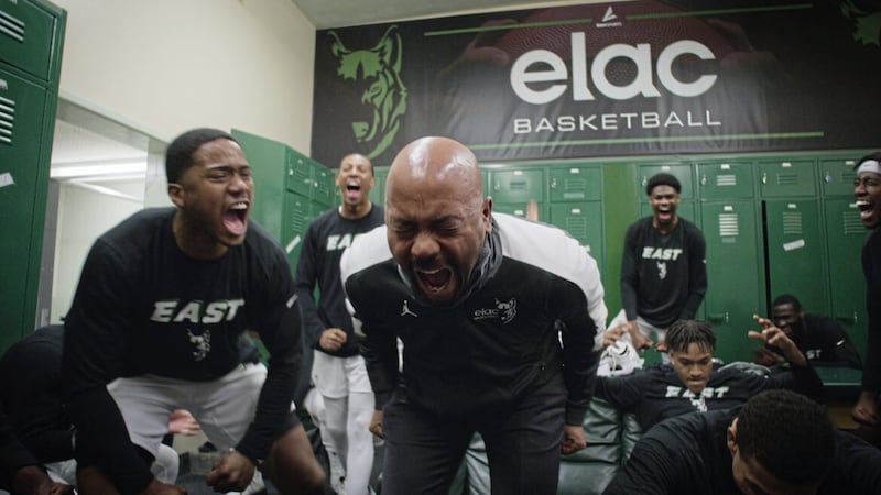 Coach John Mosley celebrates with his team in Last Chance U 
