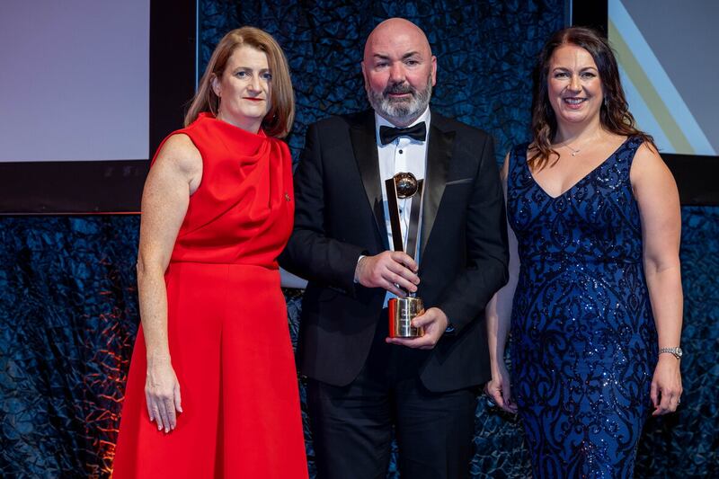 Matthew Twomey (centre) of Cork receives the  Manager of the Year Award with Camogie Association Uachtarán, Hilda Breslin,  and Camogie Association Ard Stiúrthóir, Sinead McNulty