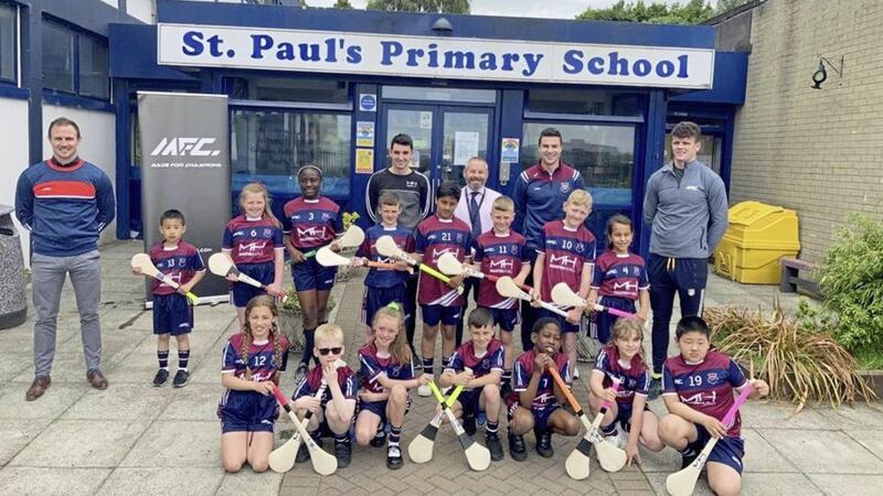 St Paul&#39;s Primary School in west Belfast show off their new kit sponsored by Martin Hurls. Pictured Michael McCann (extreme left) and Joe Maskey (extreme, right) with principal Sean McNamee (centre, back row) and teacher Mark Kelly, to Mr McNamee&#39;s left 