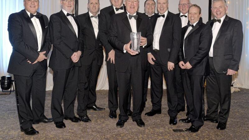Terence Donnelly (front centre), winner of the lifetime achievement award, pictured with company staff at the awards night 