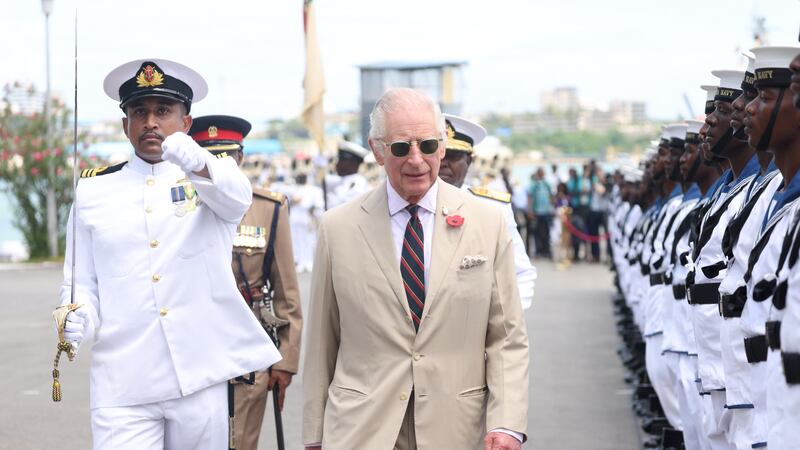 The King views the guard of honour during a ceremonial welcome at Mtongwe Naval Base (Ian Vogler/Daily Mirror/PA)