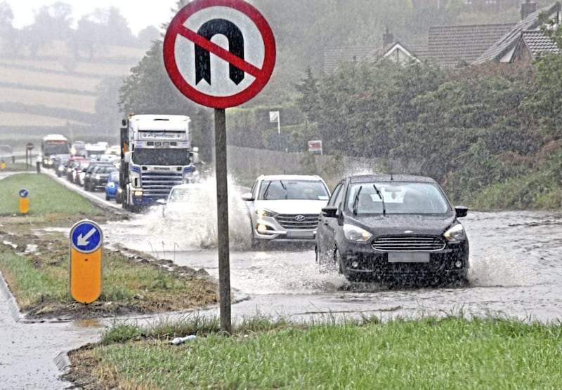 Traffic was crawling at a snail&#39;s pace through serious flooding on the main Belfast to Newry Road at Dromore on Saturday afternoon. 