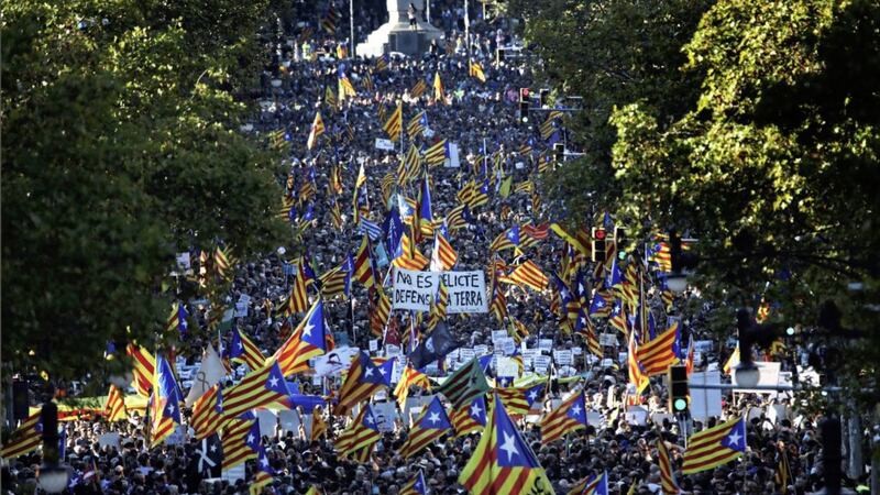               Thousents protesters wave Catalonia independence flags as they take part at a rally against the National Court&#39;s decision to imprison civil society leaders, in Barcelona, Spain, Saturday, Oct. 21, 2017. The Spanish government moved decisively Saturday to use a previously untapped constitutional power so it can take control of Catalonia and derail the independence movement led by separatist politicians in the prosperous industrial region.(AP Photo/Emilio Morenatti)             