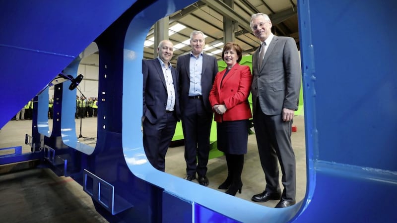 L-R: Eugene and Adrian Dixon, directors of Maine Surface Finishing with Economy Minister Diane Dodds, and Invest NI boss Kevin Holland. Photo Kelvin Boyes / Press Eye 