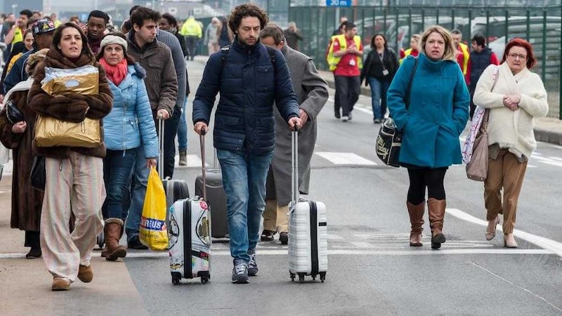 People walk away from Brussels airport after explosions. Picture by Geert Vanden Wijngaert 