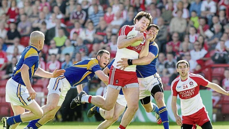 Derry&#39;s James Kielt blocked by Aidan Rowan of Longford during the 2014 All Ireland qualifier. Picture by Margaret McLaughlin 
