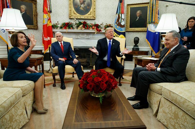 House Minority Leader Rep. Nancy Pelosi, D-Calif., Vice President Mike Pence, President Donald Trump, and Senate Minority Leader Chuck Schumer, D-N.Y., argue during a meeting in the Oval Office of the White House