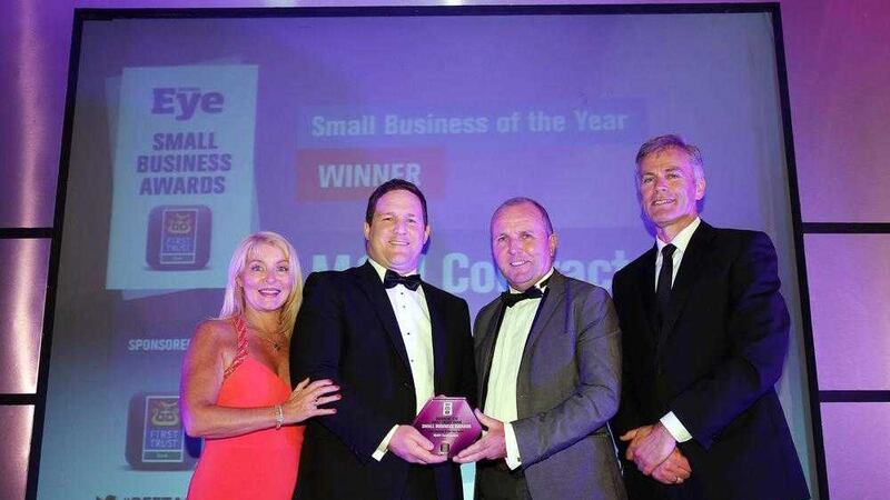 Gareth and Noel Loye from M&amp;M Contractors collect the Small Business of the Year award from Des Moore (First Trust Bank) and Brenda Buckley (Business Eye). Photo: Kelvin Boyes/Presseye 