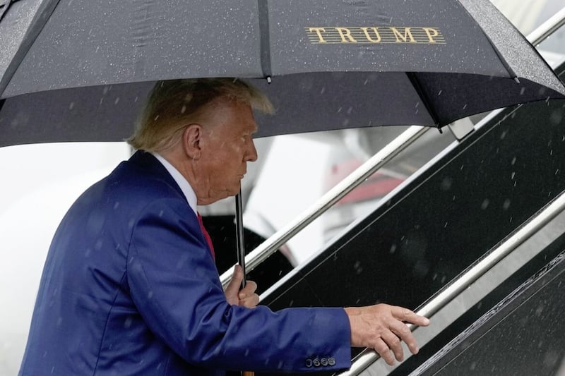 Former President Donald Trump boards his plane at Ronald Reagan Washington National Airport in Arlington, Virginia after facing a judge on federal conspiracy charges that allege he conspired to subvert the 2020 election 
