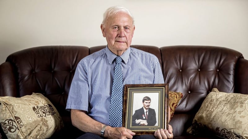 Ernie Wilson at his home in Fermanagh with a picture of his son. Picture by Liam McBurney/RAZORPIX.