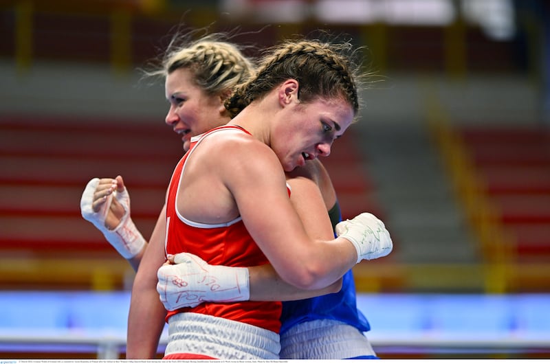 A devastated Grainne Walsh is embraced by Poland's Aneta Rygielska after Monday's winner-takes-all 66kg quarter-final in Italy. Picture by Ben McShane/Sportsfile